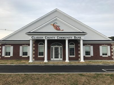 clarion county community bank sign on stone wall